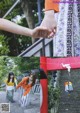 A couple holding hands while walking down a set of stairs.