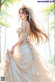 A woman in a wedding dress standing in the woods.